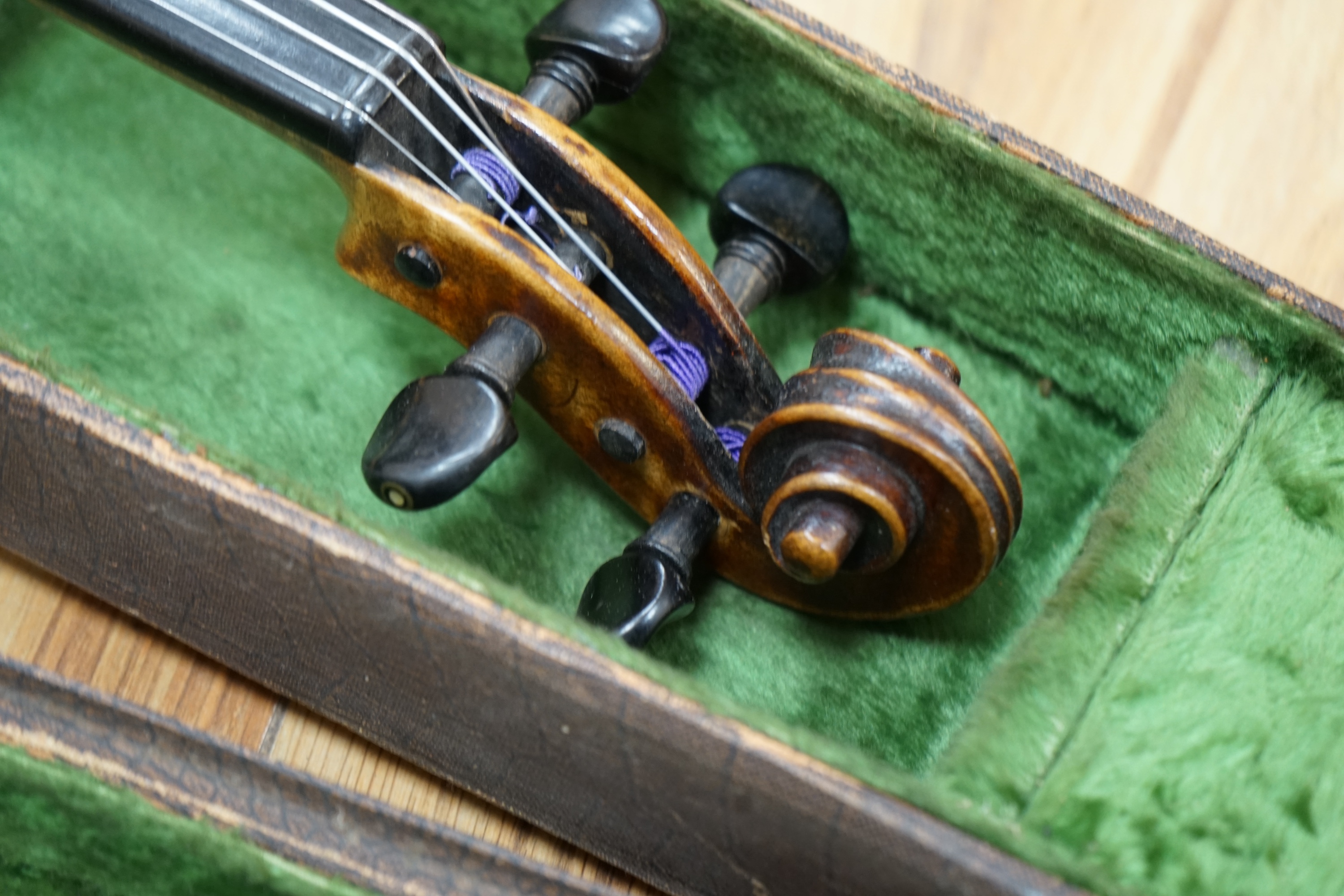 A cased 19th century English violin, with label reading George Craske, Fecit 1842, Edward Crompton, 54, Barton Arcade, Deansgate, Manchester, body length 36cm. Condition - fair to good.